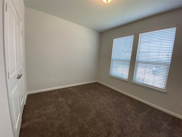 1037 Madelia Ave, Fort Worth, TX 76177 - empty room featuring dark colored carpet and baseboards