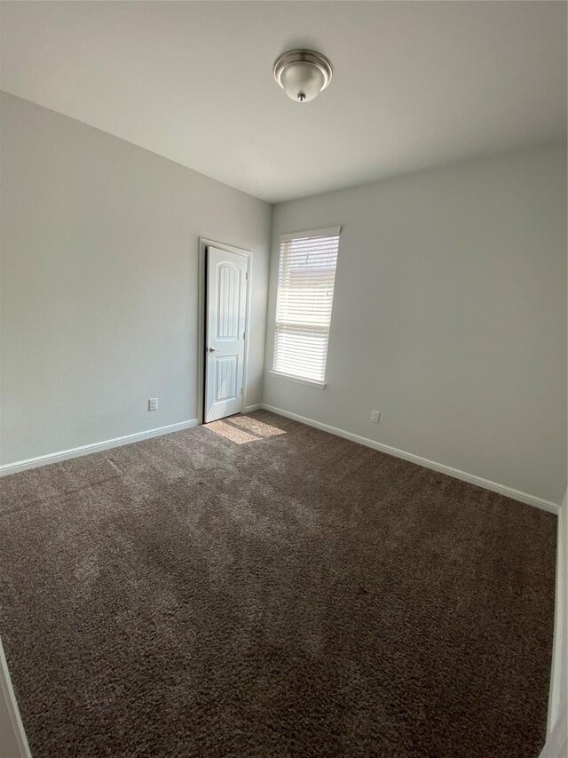 1037 Madelia Ave, Fort Worth, TX 76177 - empty room with baseboards and carpet floors