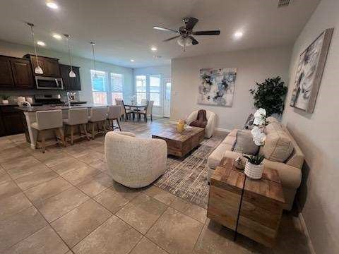 1037 Madelia Ave, Fort Worth, TX 76177 - living room with recessed lighting, ceiling fan, and light tile patterned floors