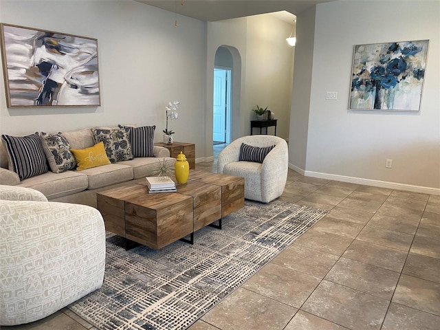 1037 Madelia Ave, Fort Worth, TX 76177 - tiled living room featuring arched walkways and baseboards