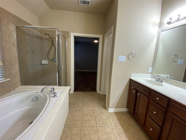 1705 Spanish Moss Way, Savannah, TX 76227 - full bathroom with a garden tub, vanity, a stall shower, tile patterned floors, and lofted ceiling