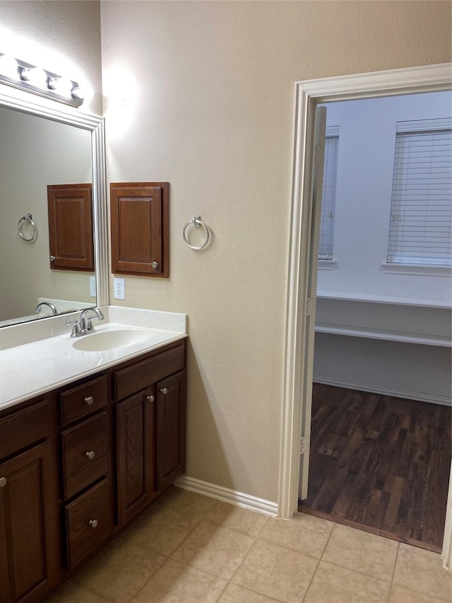 1705 Spanish Moss Way, Savannah, TX 76227 - bathroom with vanity, tile patterned flooring, and baseboards
