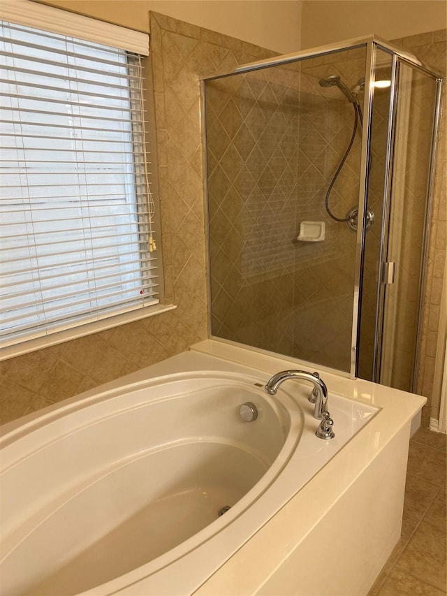 1705 Spanish Moss Way, Savannah, TX 76227 - full bathroom featuring a bath, a stall shower, and tile patterned flooring