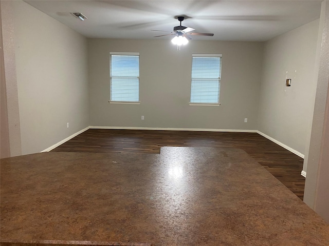 1705 Spanish Moss Way, Savannah, TX 76227 - spare room with a ceiling fan, baseboards, and dark wood-type flooring