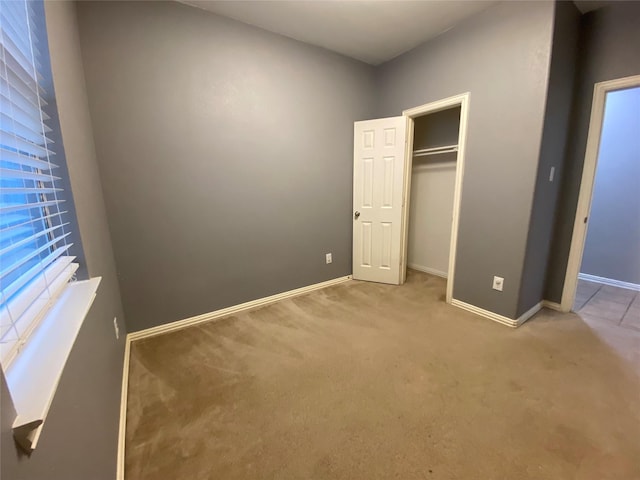 1705 Spanish Moss Way, Savannah, TX 76227 - unfurnished bedroom with carpet flooring, baseboards, and a closet