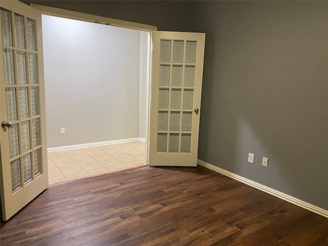 1705 Spanish Moss Way, Savannah, TX 76227 - spare room featuring wood finished floors, baseboards, and french doors
