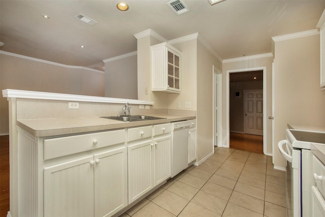 4512 Blue Jay Ln, Sherman, TX 75092 - kitchen with a sink, white appliances, glass insert cabinets, ornamental molding, and light countertops