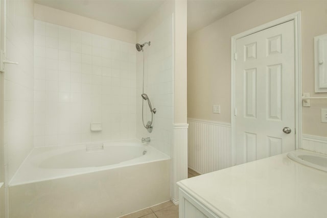 4512 Blue Jay Ln, Sherman, TX 75092 - bathroom featuring washtub / shower combination, vanity, tile patterned floors, and wainscoting