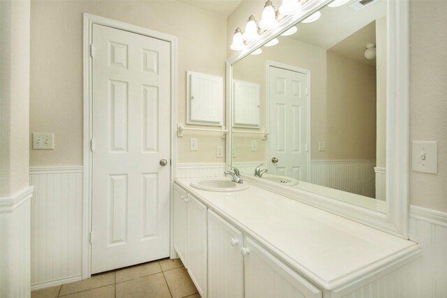 4512 Blue Jay Ln, Sherman, TX 75092 - bathroom with a wainscoted wall, vanity, and tile patterned floors