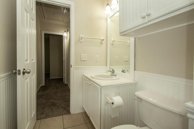 4512 Blue Jay Ln, Sherman, TX 75092 - half bathroom featuring toilet, wainscoting, vanity, and tile patterned flooring