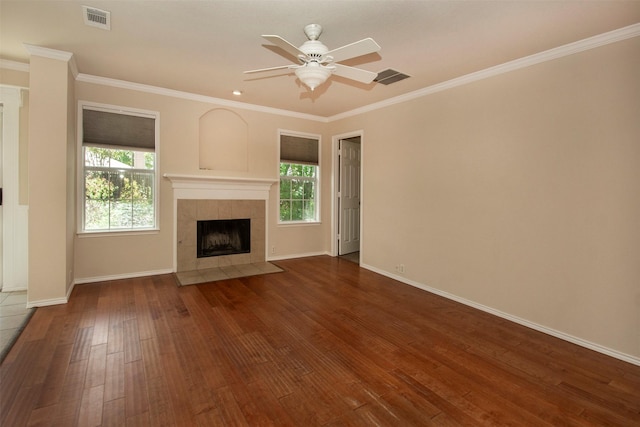 4512 Blue Jay Ln, Sherman, TX 75092 - unfurnished living room with hardwood / wood-style flooring, a tiled fireplace, baseboards, ceiling fan, and crown molding