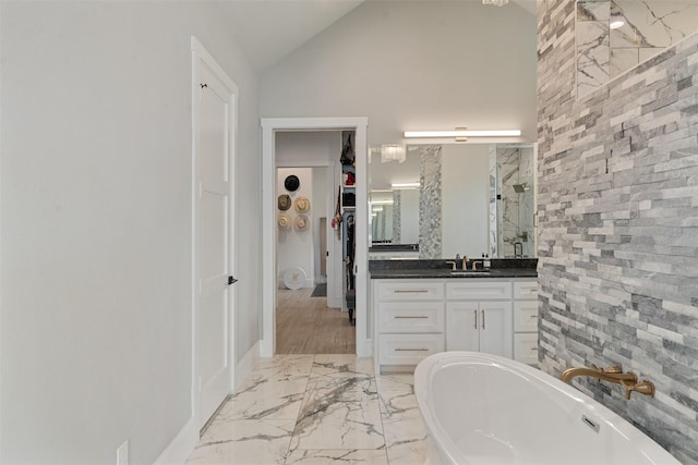 18280 Red Oak Dr, Mabank, TX 75156 - full bath with a walk in closet, vanity, a soaking tub, a stall shower, and marble finish floors