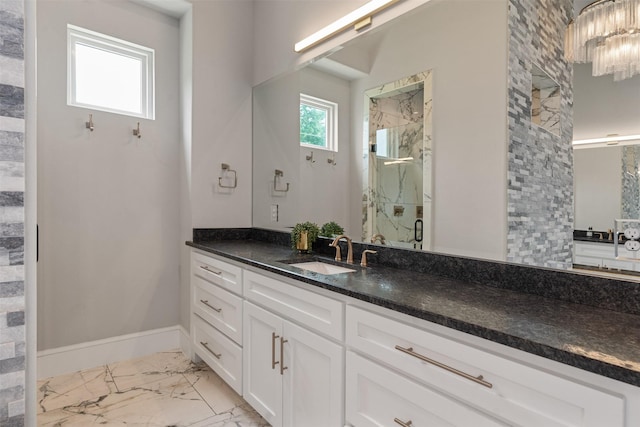 18280 Red Oak Dr, Mabank, TX 75156 - bathroom featuring a marble finish shower, vanity, marble look tiles, and baseboards