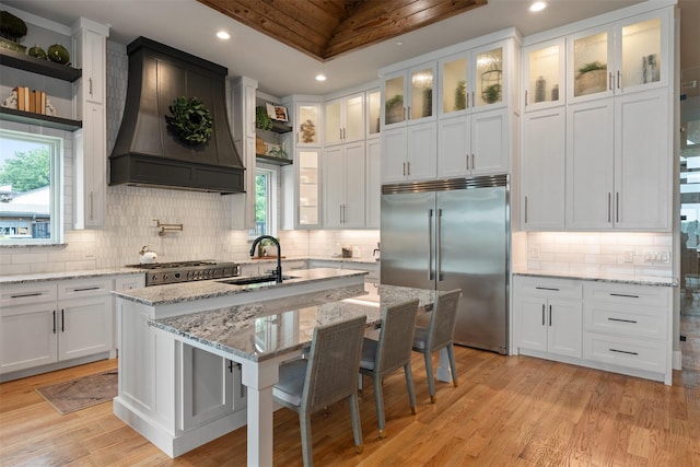 18280 Red Oak Dr, Mabank, TX 75156 - kitchen with stainless steel built in refrigerator, custom range hood, a sink, white cabinets, and recessed lighting