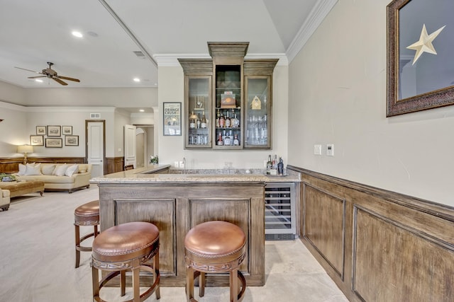 1516 Byron Nelson Pkwy, Southlake, TX 76092 - indoor wet bar with beverage cooler, crown molding, ceiling fan, wainscoting, and recessed lighting