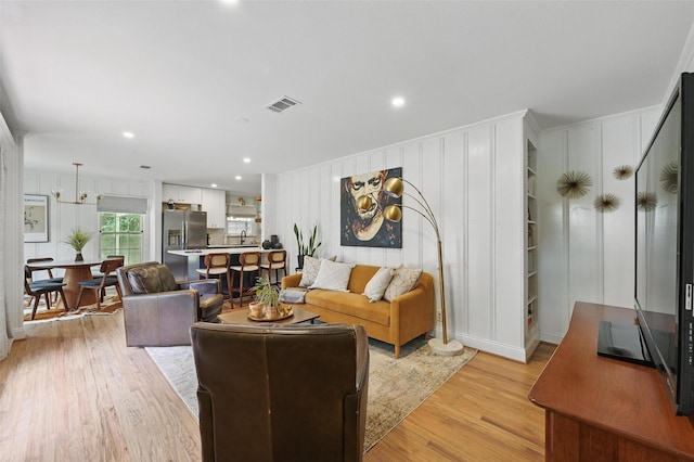 916 Carondolet Ct, River Oaks, TX 76114 - living area with light wood-style floors, a decorative wall, and recessed lighting