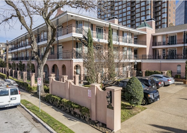 3208 Cole Ave Unit 2205, Dallas, TX 75204 - view of apartment building / complex featuring uncovered parking