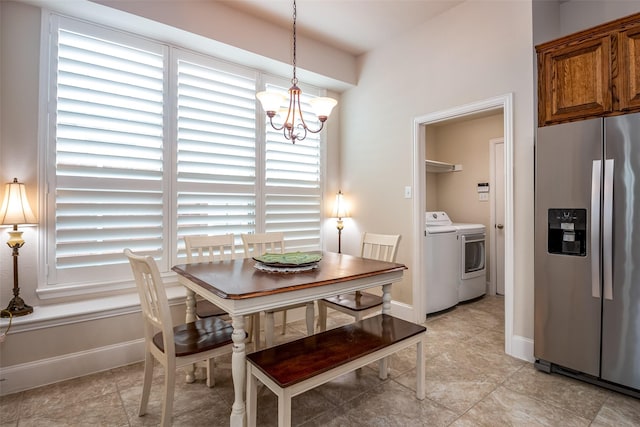 2636 Deer Hollow Dr, Little Elm, TX 75068 - dining room featuring washer and clothes dryer, a chandelier, and light tile patterned floors