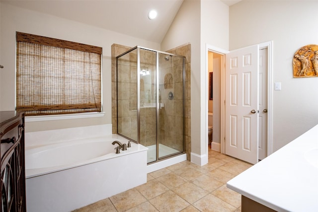 2636 Deer Hollow Dr, Little Elm, TX 75068 - full bathroom featuring a garden tub, a stall shower, toilet, vanity, and vaulted ceiling