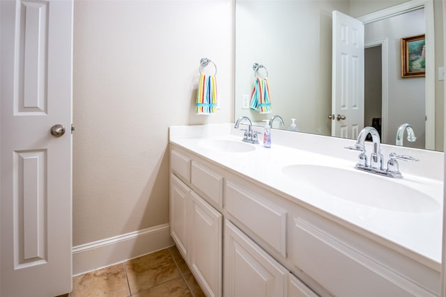 2636 Deer Hollow Dr, Little Elm, TX 75068 - bathroom featuring double vanity, baseboards, and tile patterned flooring