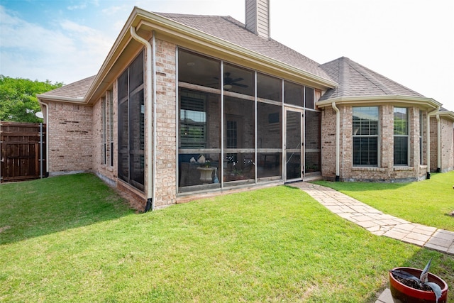 2636 Deer Hollow Dr, Little Elm, TX 75068 - rear view of property with a sunroom, a chimney, brick siding, and roof with shingles
