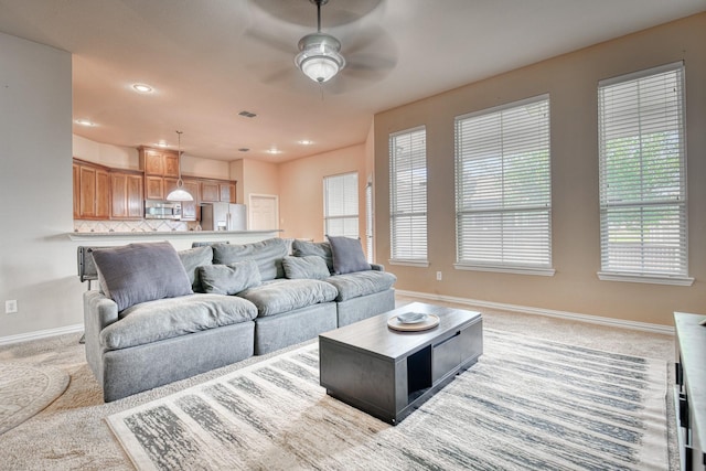 6939 Truth Dr, Dallas, TX 75236 - living room with a ceiling fan, baseboards, light carpet, and recessed lighting