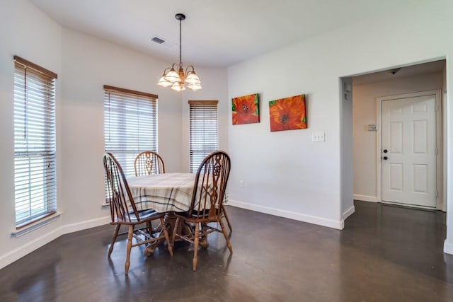 1759 County Road 2712, Caddo Mills, TX 75135 - dining room with a chandelier, baseboards, and concrete flooring