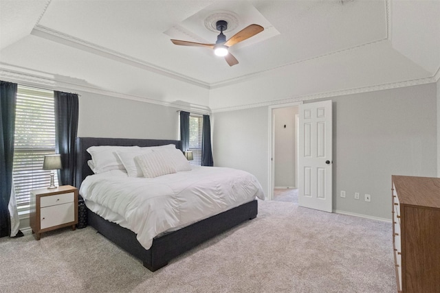 517 Sunset Dr, Hurst, TX 76054 - bedroom featuring a raised ceiling, light colored carpet, a ceiling fan, crown molding, and baseboards