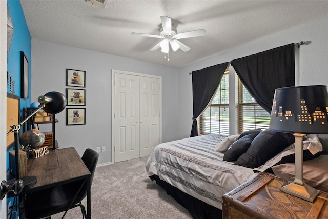 517 Sunset Dr, Hurst, TX 76054 - carpeted bedroom with a closet, a ceiling fan, and a textured ceiling
