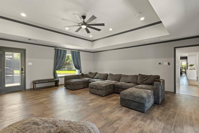 517 Sunset Dr, Hurst, TX 76054 - living area featuring a ceiling fan, a raised ceiling, crown molding, wood finished floors, and recessed lighting
