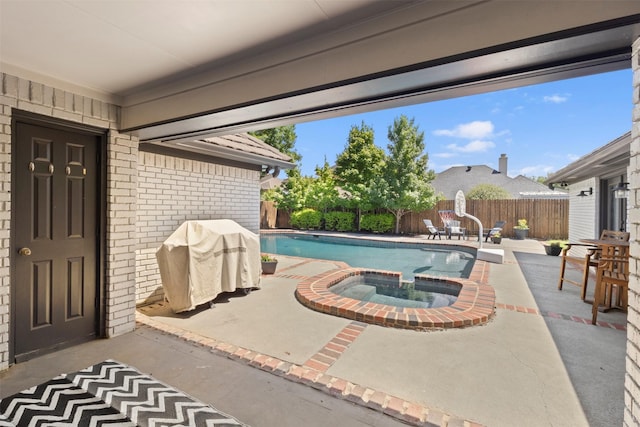 517 Sunset Dr, Hurst, TX 76054 - view of swimming pool featuring a patio, a fenced backyard, a grill, and a pool with connected hot tub