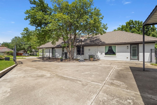 517 Sunset Dr, Hurst, TX 76054 - rear view of house featuring brick siding