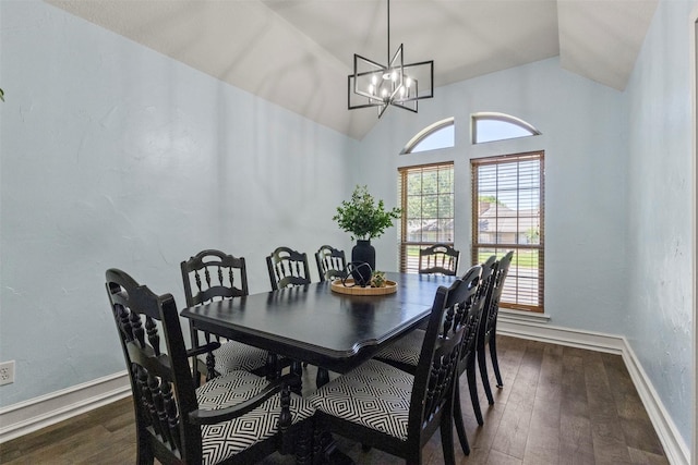 517 Sunset Dr, Hurst, TX 76054 - dining area with dark wood-style flooring, vaulted ceiling, baseboards, and a chandelier