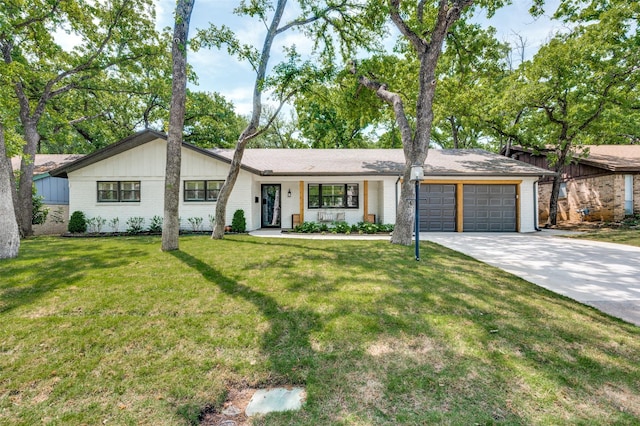 1913 Windlea Dr, Euless, TX 76040 - view of front of home featuring an attached garage, concrete driveway, brick siding, and a front lawn