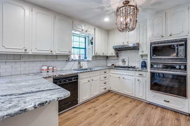 1913 Windlea Dr, Euless, TX 76040 - kitchen featuring black appliances, a sink, a chandelier, white cabinets, and light stone countertops