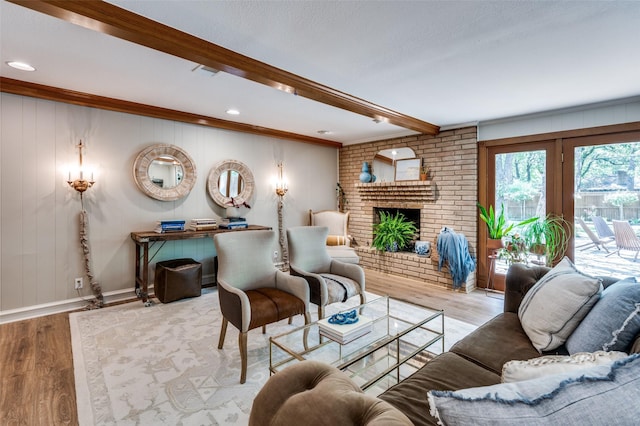 1913 Windlea Dr, Euless, TX 76040 - living area featuring beam ceiling, wood finished floors, baseboards, and a fireplace