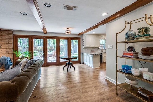 1913 Windlea Dr, Euless, TX 76040 - living room featuring light wood-style floors, plenty of natural light, recessed lighting, beamed ceiling, and baseboards