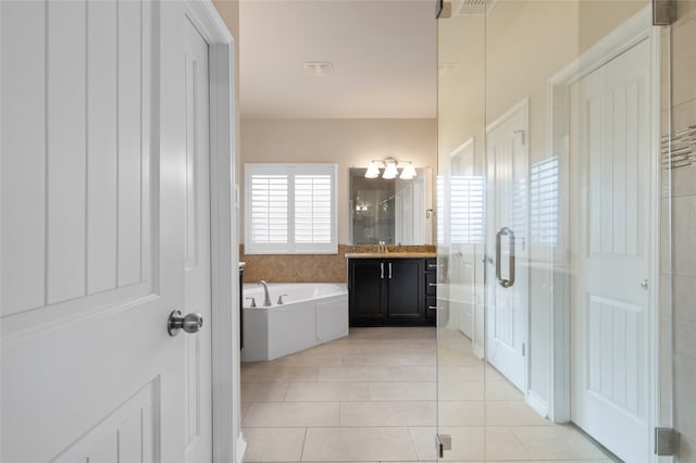 5505 Wisdom Ct, Waco, TX 76708 - bathroom with vanity, a garden tub, a shower stall, tile patterned flooring, and a chandelier