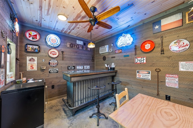 5505 Wisdom Ct, Waco, TX 76708 - indoor dry bar with wooden walls, ceiling fan, and concrete floors