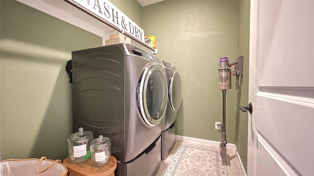 1605 Anacua Ln, Wylie, TX 75098 - laundry area featuring washing machine and dryer and baseboards