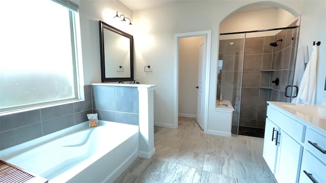 1605 Anacua Ln, Wylie, TX 75098 - full bath with vanity, a shower stall, a bath, baseboards, and marble look tiles