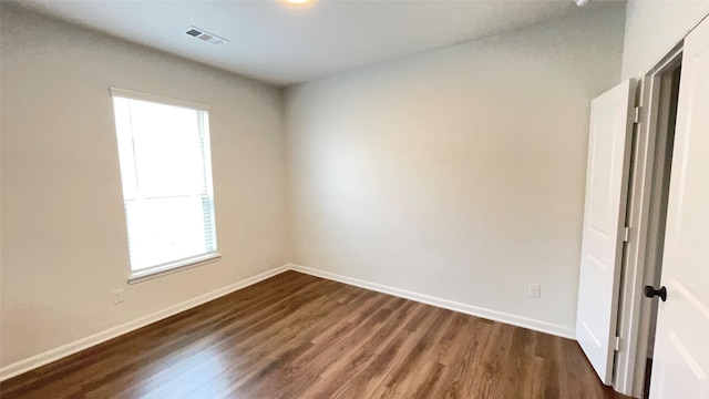 1605 Anacua Ln, Wylie, TX 75098 - unfurnished room with plenty of natural light, dark wood-type flooring, and baseboards