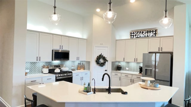 1605 Anacua Ln, Wylie, TX 75098 - kitchen with appliances with stainless steel finishes, a sink, a kitchen bar, a kitchen island with sink, and tasteful backsplash