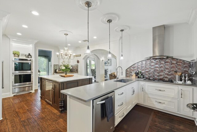1208 Chandler Cir, Prosper, TX 75078 - kitchen featuring a warming drawer, appliances with stainless steel finishes, a chandelier, light countertops, and backsplash