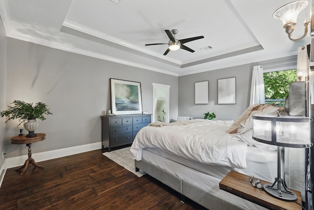 1208 Chandler Cir, Prosper, TX 75078 - bedroom featuring a tray ceiling, dark wood-style floors, ornamental molding, a ceiling fan, and a chandelier
