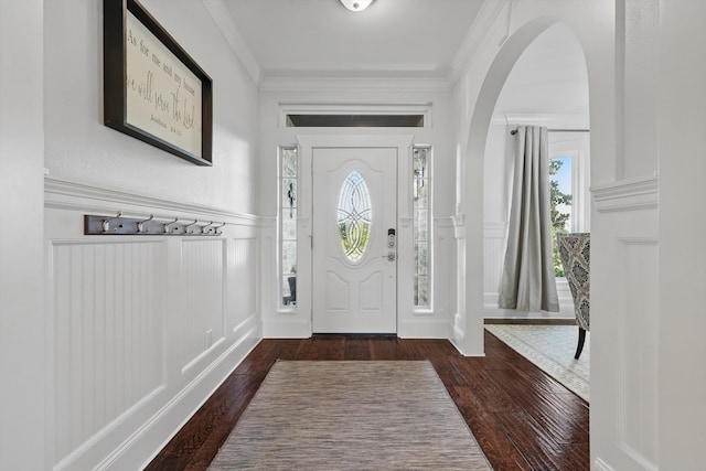 1208 Chandler Cir, Prosper, TX 75078 - foyer entrance with a decorative wall, hardwood / wood-style floors, arched walkways, a wainscoted wall, and crown molding