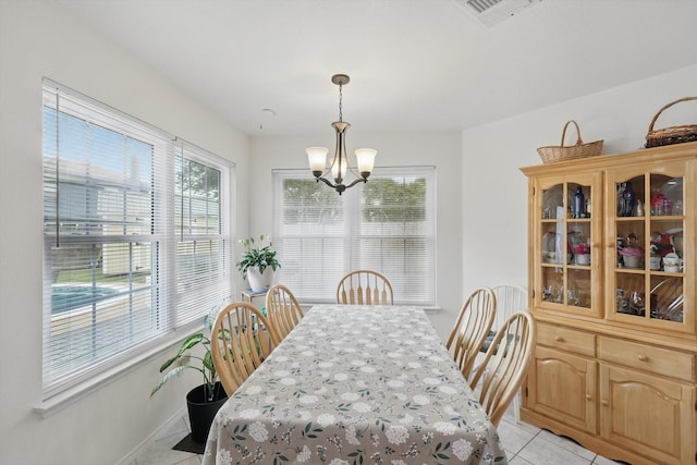 9829 Stoney Bridge Rd, Fort Worth, TX 76108 - dining room with a chandelier, plenty of natural light, light tile patterned floors, and baseboards