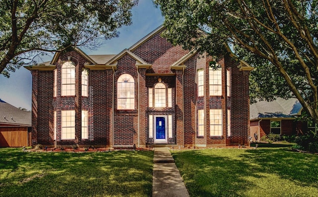 1104 Bayshore St, Allen, TX 75002 - traditional-style home featuring brick siding and a front lawn