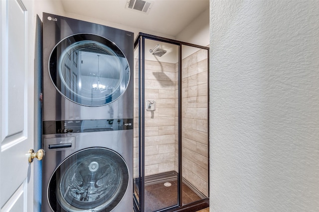 1104 Bayshore St, Allen, TX 75002 - washroom with estacked washer and dryer and a textured wall