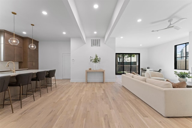 4516 Shenandoah Ave, University Park, TX 75205 - living area featuring light wood finished floors, recessed lighting, plenty of natural light, and baseboards